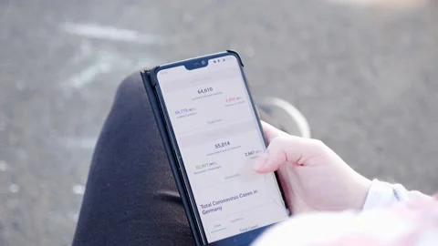 Scrolling through Corona Virus case statistics and deaths in Germany, 4k 60fps Stock Footage 140594372