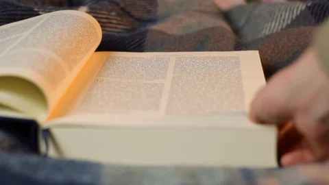 Scrolling through the pages of the Holy Bible, closeup Stockbeeldmateriaal 127551063