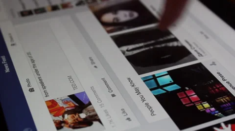 Scrolling through people on facebook with tablet Video stock 33729576
