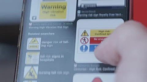 Scrolling Through Warning Signs On A Mobile Phone With A Macro Lens… 4K Vídeos de archivo 271518262