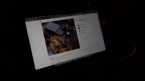 Scrolling trough Instagram on in Safari on a MacBook. Stock Footage 102511032
