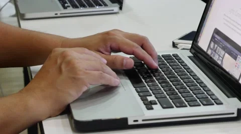 Scrolls a Website Using Her Laptop Track Pad Stock Footage 62835592