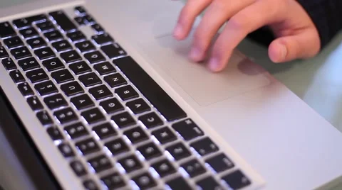 Scrolls a Website Using His Laptop Track Pad Stock Footage 43374295