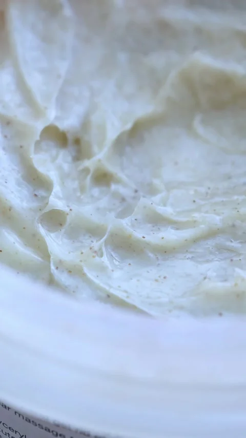 Scrub background texture in jar. Skin care, body or facial scrub backdrop. Stock Footage 304801910