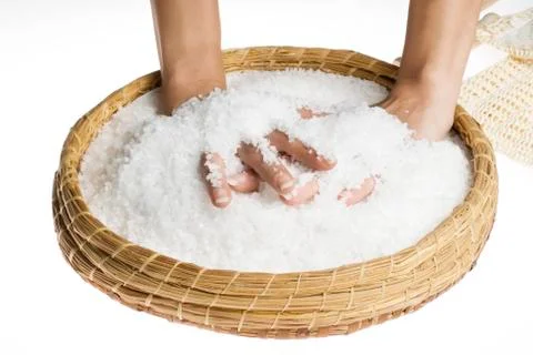 Scrub hands with salt Stock Photos