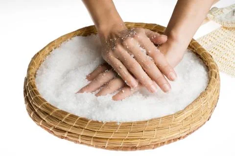 Scrub hands with salt Stock Photos