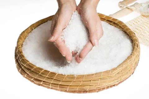 Scrub hands with salt Stock Photos