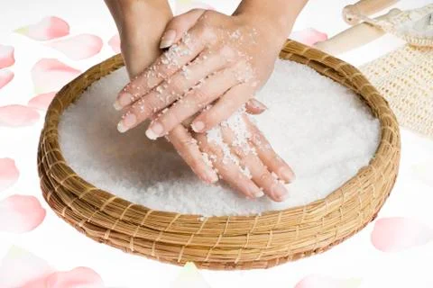 Scrub hands with salt Stock Photos