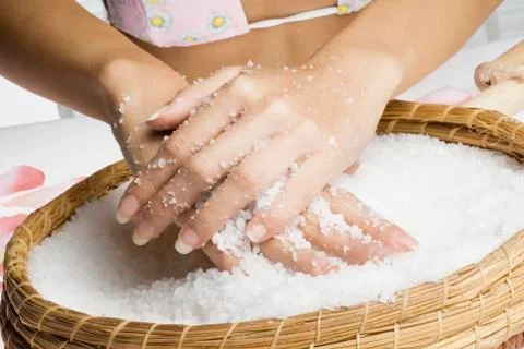 Scrub hands with salt Stock Photos