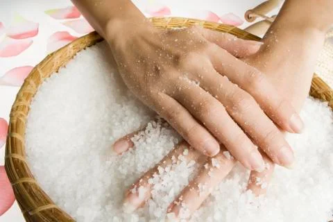 Scrub hands with salt Stock Photos