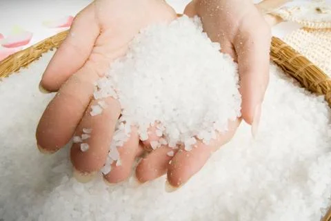 Scrub hands with salt Stock Photos