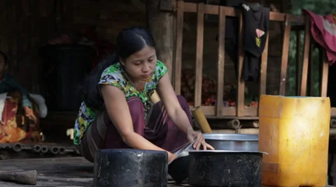 Scrubbing Pots in Burma Stock Footage 37350658