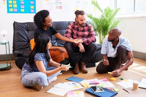 Scrum team brainstorms for mobile app idea, UX design and planning development Stock Photos