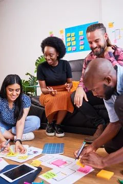 Scrum team brainstorms for mobile app idea, UX design and planning development Stock Photos