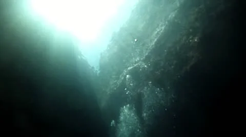 Scuba air bubbles float to surface between rock reef HD 0044 Stock Footage 12522896