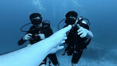 SCUBA diver check hand in clear deep sea water2 Stock Footage 116611097