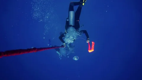 Scuba diver decending down a line towards the bottom. Stock Footage 96413617