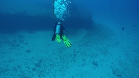 A scuba diver decends down a line to the deck of the C-58 wreck near Cancun. Stock Footage 96471797