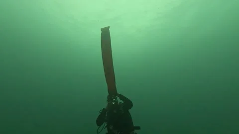 Scuba Diver Deploys a Surface Marker Buoy Stock Footage 254265644