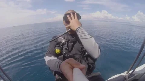 Scuba diver enter the water through the back roll method 動画素材 48024603