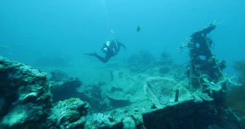 Scuba Diver Exploring Big Ship Wreck sunk during World War II Stock Footage 290014481