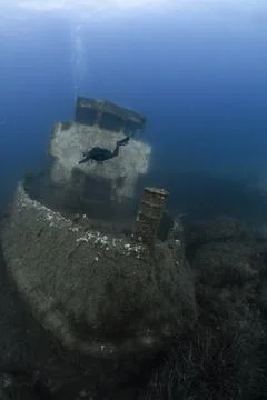 Scuba diver exploring Malta shipwreck underwater environment Stock Photos