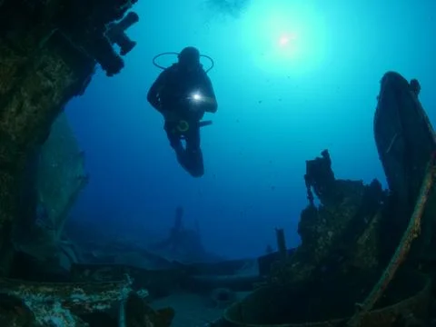 Scuba diver exploring ship wreck photo shipwreck Stock Photos