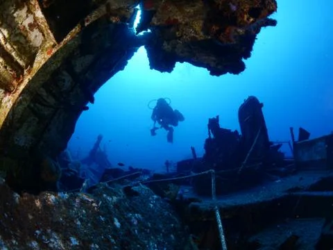 Scuba diver exploring ship wreck photo shipwreck Stock Photos