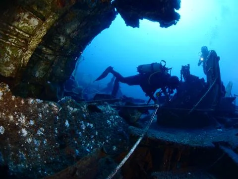 Scuba diver exploring ship wreck photo shipwreck Stock Photos