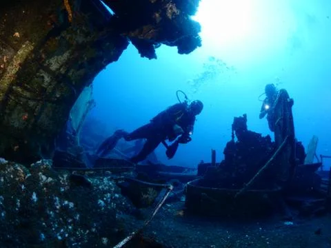 Scuba diver exploring ship wreck photo shipwreck Stock Photos
