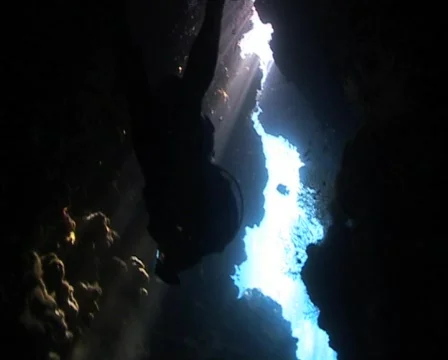 Scuba Diver exploring an underwater cave Stock Footage 574335