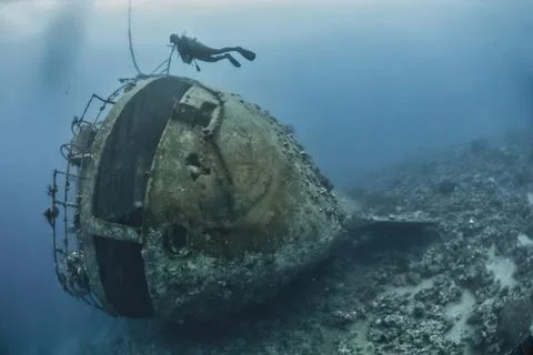 Scuba diver exploring a wreck Stock Photos