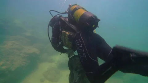 Scuba Diver is Going with Garbage Bag to Clean Underwater Stock Footage 144849520