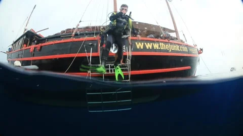 Scuba diver jumping into ocean slow motion Stock Footage 50994888