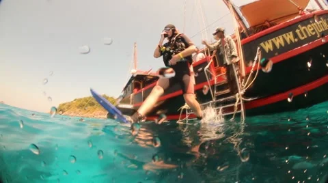 Scuba diver jumping in slow motion Stock Footage 50994169
