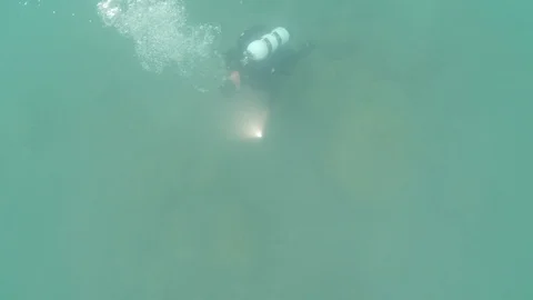 Scuba diver low viz bubbles with light Stock Footage 115879080