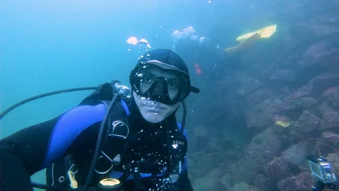 Scuba Diver Shapes a Big Bubble Stock Footage 129115478