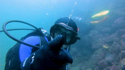 Scuba Diver Shapes a Big Bubble Stock Footage 129115480