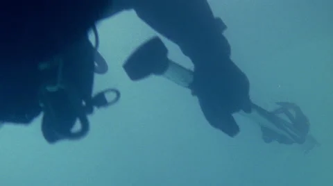Scuba Diver Swims Into Frame With Spear Stock Footage 45890997