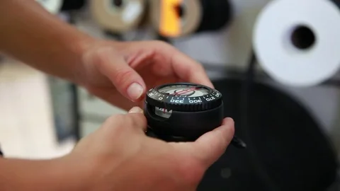 SCUBA diver testing underwater compass. Navigation device. Stock Footage 82984018