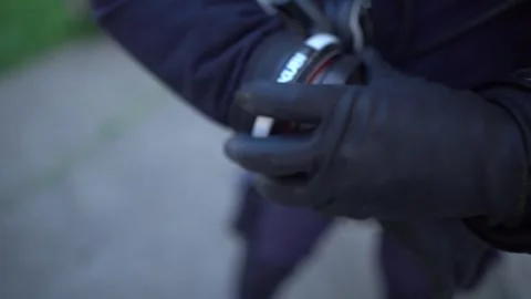 Scuba diver tightening and securing diving equipment on the wrist while Stock Footage 331618637