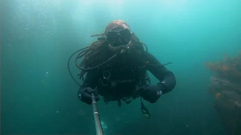 Scuba Diverman is Self Shooting Himself Underwater Stock Footage 129111409