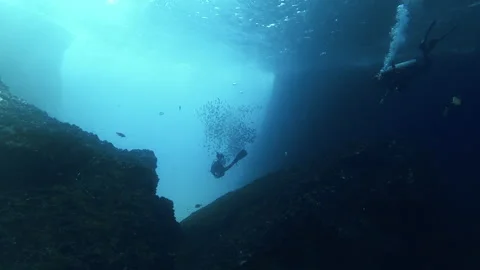 Scuba Divers against light Stock Footage 157994129