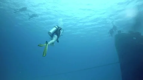 Scuba Divers Approaches Boat Stock Footage 75798625