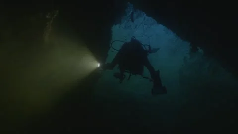 Scuba divers explores old ship wreck, silhouette, under water, Palau Видео 334131287