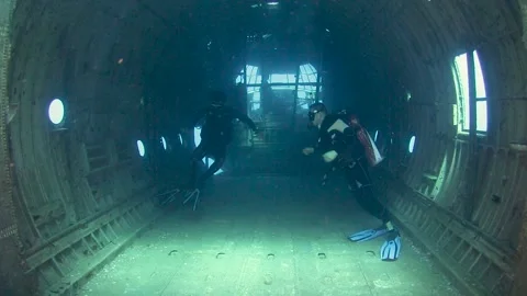 Scuba Divers Exploring Inside Big Airplane C130 Wreck Stock Footage 178952245