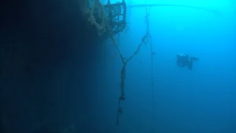 SCUBA divers exploring  the shipwreck Zenobia, underwater, Cyprus Stock Footage 82755609