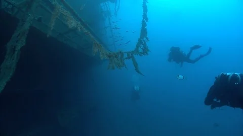 SCUBA divers exploring  the shipwreck Zenobia, underwater, Cyprus Stock Footage 82755628