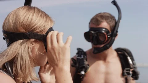 Scuba divers gesturing at beach. Stock Footage 119386222