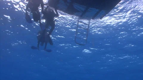 Scuba Divers getting on boat Stock Footage 2661210